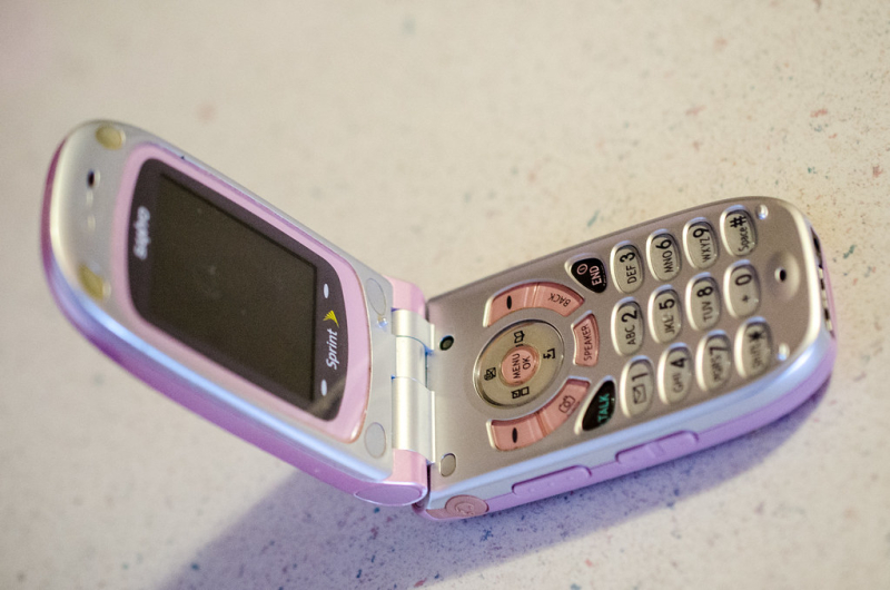 a pink and silver flip phone