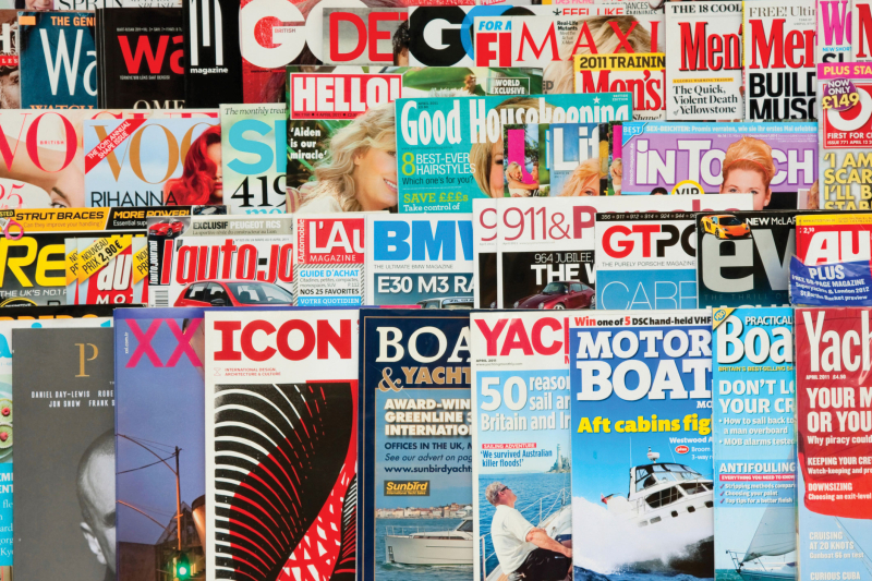 a bunch of magazines shelved