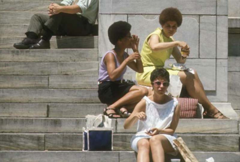 women seated on steps