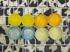 4 pairs of glass dichro plugs sitting on my keyboard