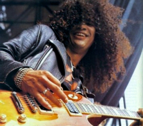 slash looking down at the camera while playing live